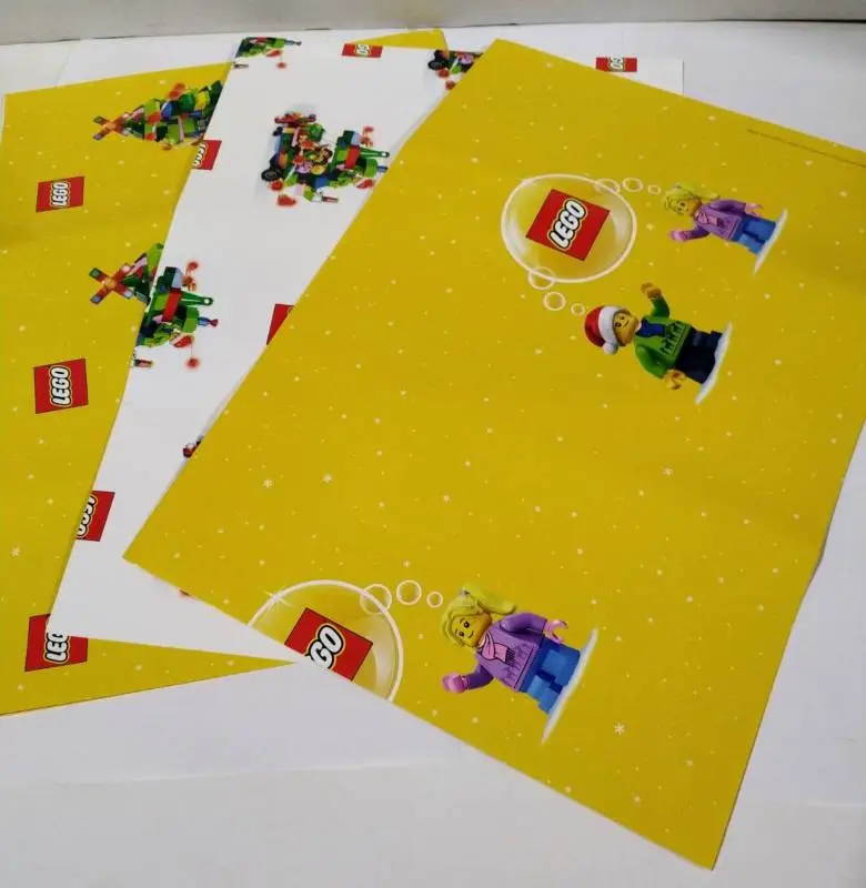 LEGO плотная фирменная упаковочная бумага - 3 листа с разными рисунками (2 желтых и 1 белый). В вакуумной упаковке